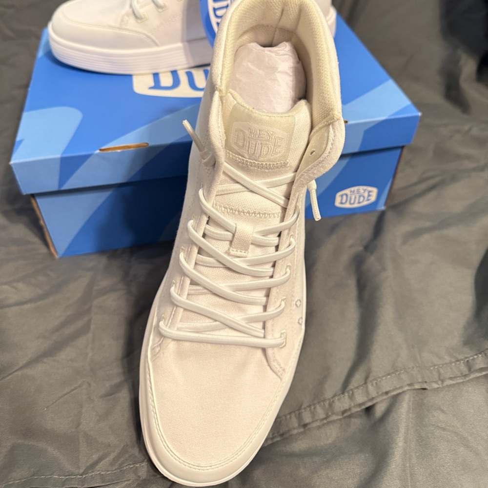 Brand new. Never worn. Hey Dudes Cody high tops. Woman’s size 12.